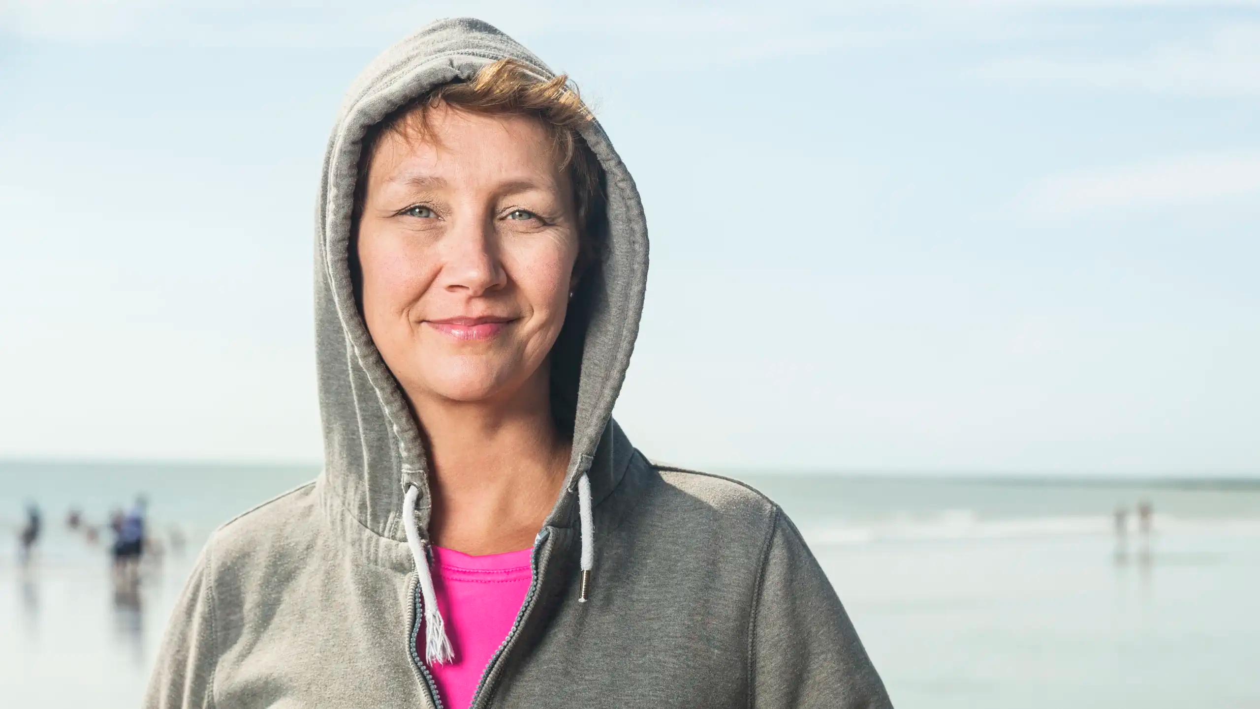 Earth Futures Lab - Woman on Beach in Hoodie